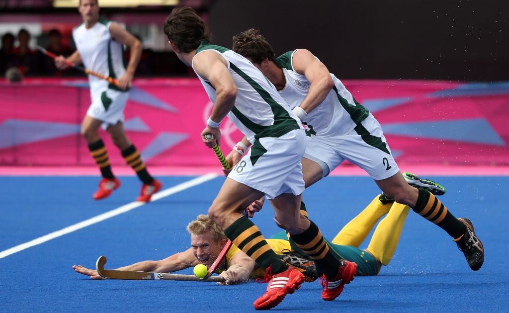 Tweed's Matthew Butturini fights for the ball against Thorton McDade and Wade Paton of South Africa. Tweed's Matthew Butturini fights for the ball against Thorton McDade and Wade Paton of South Africa.